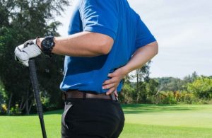 Golfer with his hand on his low back